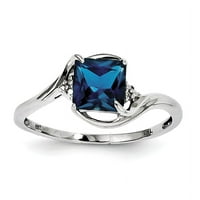 Prsten od sterling srebra obložen rodijem s dijamantom i londonskim plavim topazom. Težina dragulja-0,77 karata
